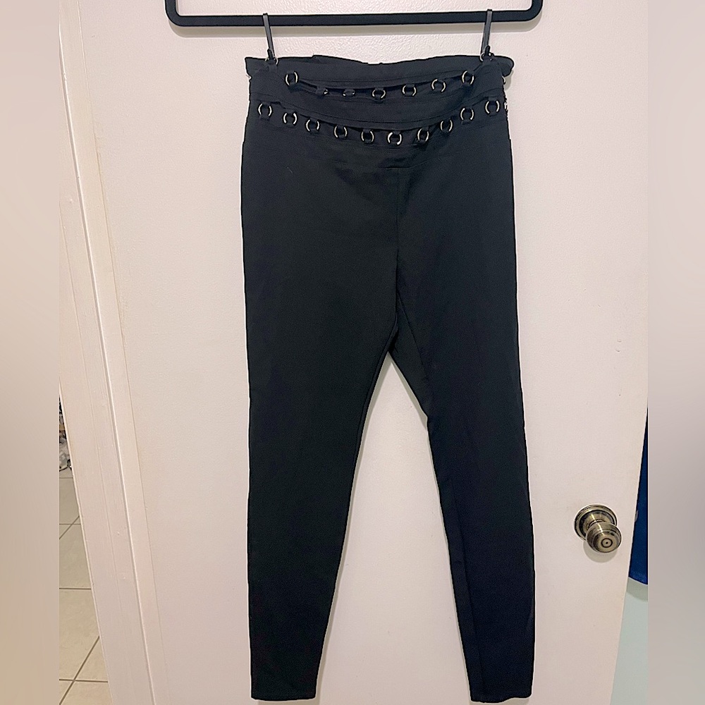 Bebe black trendy pants for sale! Size medium runs small. Cute unique style!